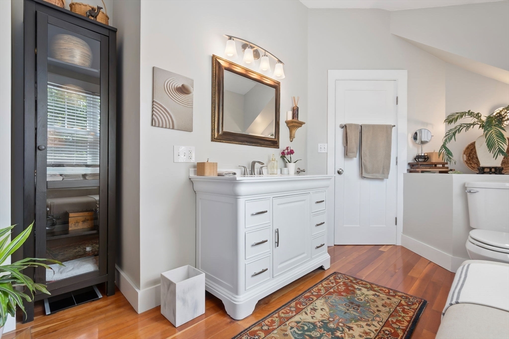 11 Beacon Street Amesbury, MA 01913 - Photo 24 of 42 a spacious bathroom with a toilet sink and mirror