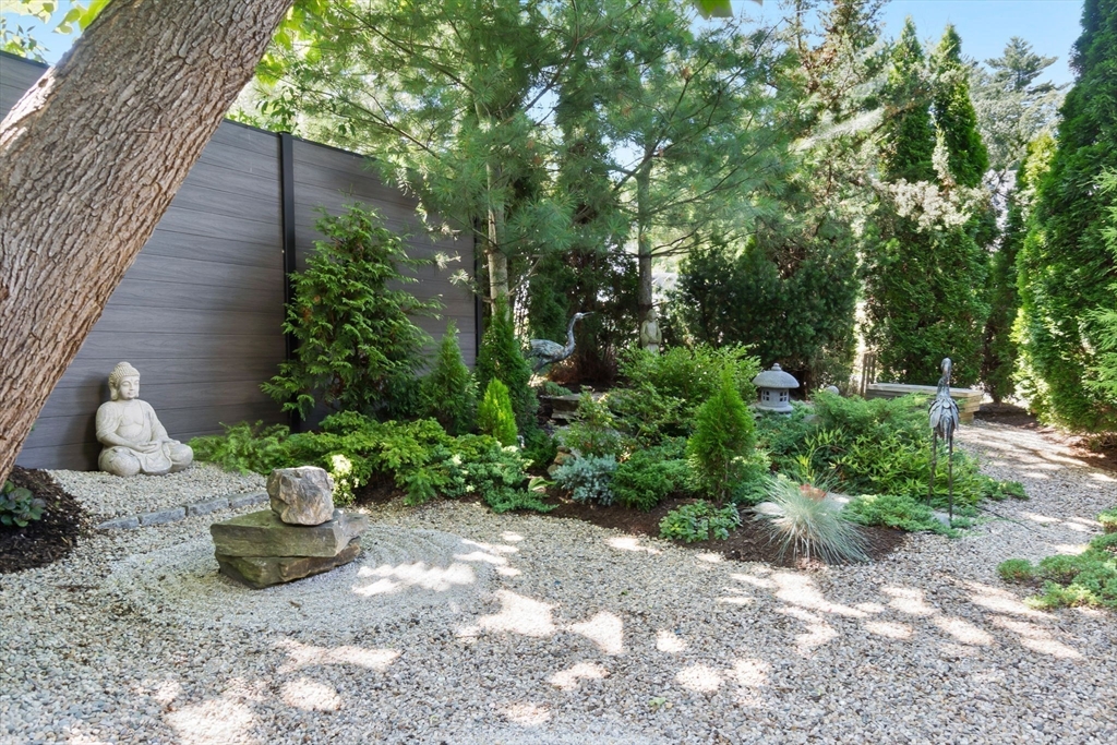 11 Beacon Street Amesbury, MA 01913 - Photo 29 of 42 a view of a chair and table potted plants