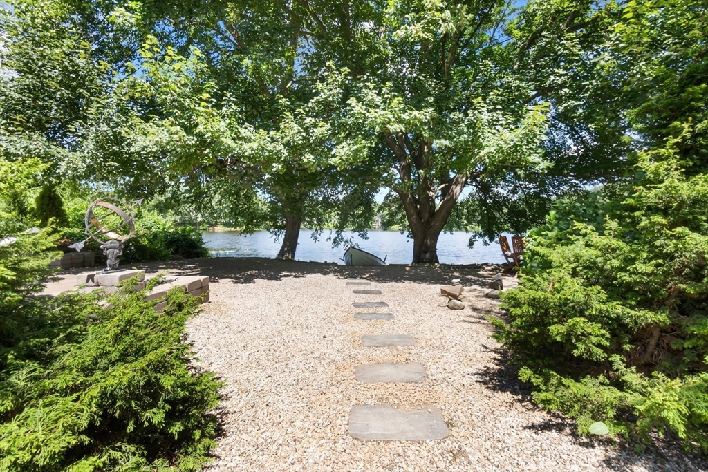 11 Beacon Street Amesbury, MA 01913 - Photo 30 of 42 a view of a yard with plants and trees
