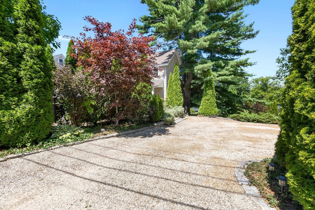 11 Beacon Street Amesbury, MA 01913 - Photo 3 of 42 a street view along with trees