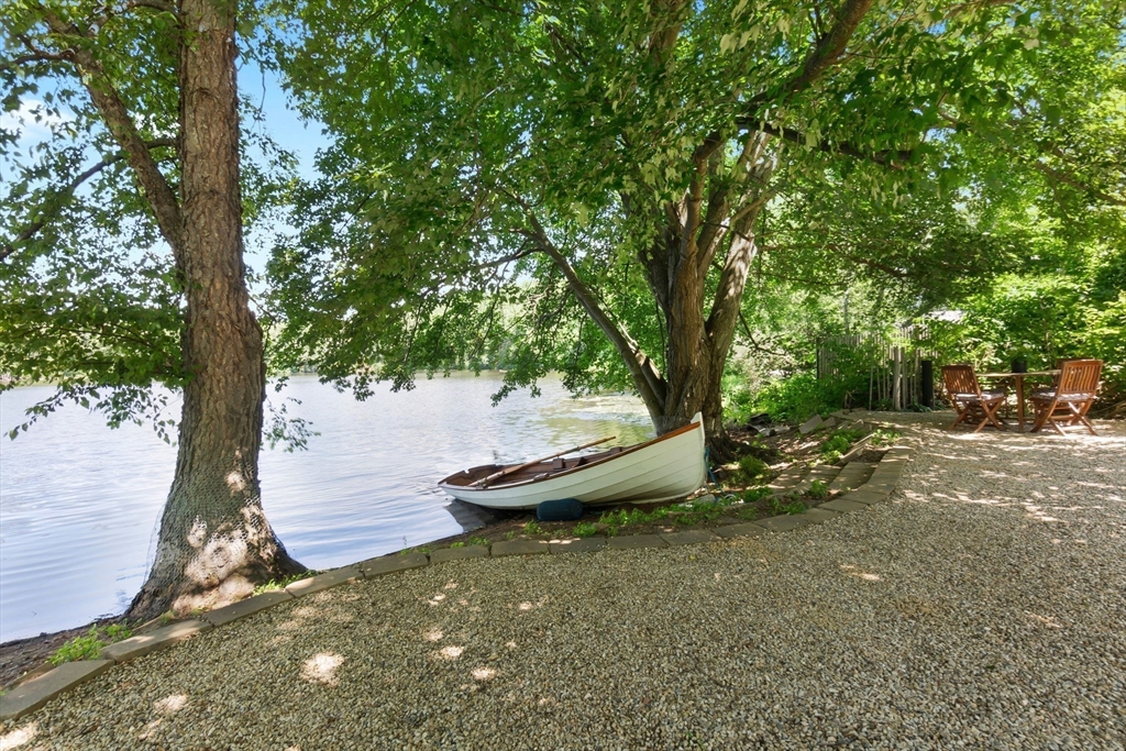 11 Beacon Street Amesbury, MA 01913 - Photo 32 of 42 a view of a backyard with large trees