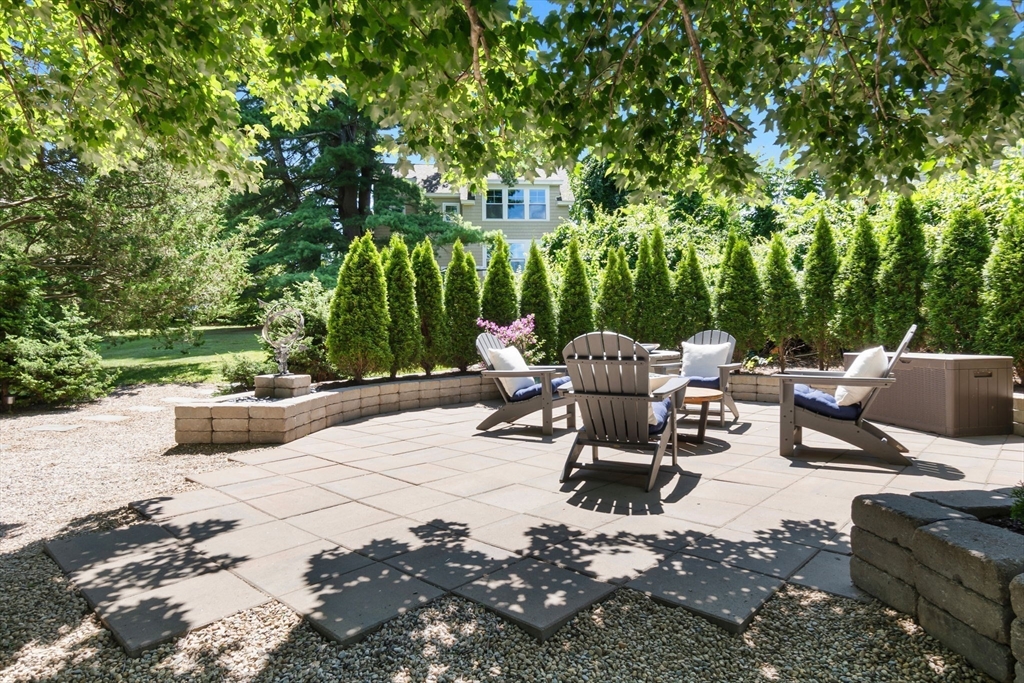 11 Beacon Street Amesbury, MA 01913 - Photo 33 of 42 a view of a patio with chairs and potted plants
