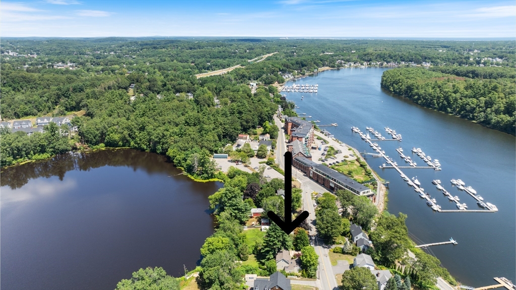 11 Beacon Street Amesbury, MA 01913 - Photo 37 of 42 an aerial view of a house with a garden and lake view