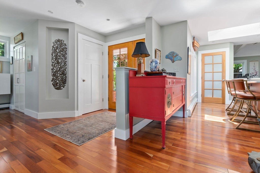 11 Beacon Street Amesbury, MA 01913 - Photo 5 of 42 a living room with furniture a dining table and wooden floor