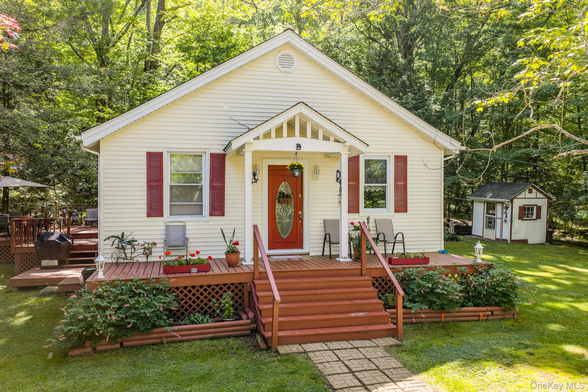 370 Starlight Road Monticello, NY 12701 - Photo 6 of 49 a front view of a house with a yard