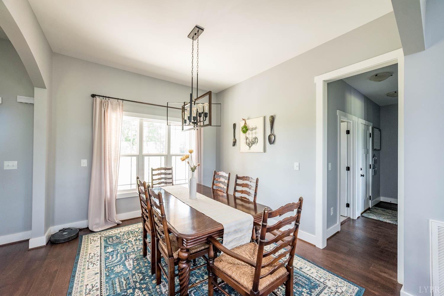 5972 Promise Land Road Appomattox, VA 24522 - Photo 15 of 84 a view of a dining room with furniture window and wooden floor