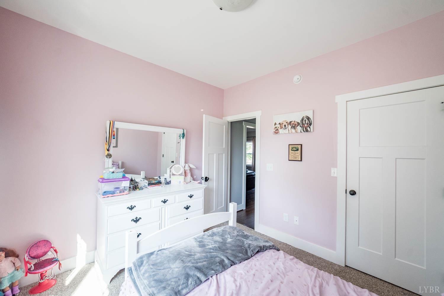 5972 Promise Land Road Appomattox, VA 24522 - Photo 29 of 84 a spacious bedroom with a bed and a dresser in it