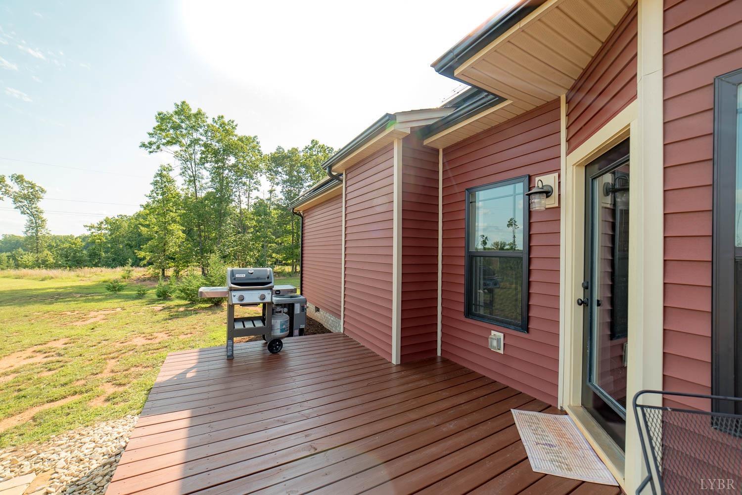 5972 Promise Land Road Appomattox, VA 24522 - Photo 52 of 84 a view of a balcony with two chairs and wooden floor
