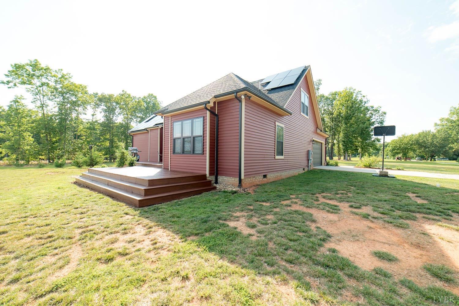 5972 Promise Land Road Appomattox, VA 24522 - Photo 56 of 84 a view of a backyard with a garden and entertaining space