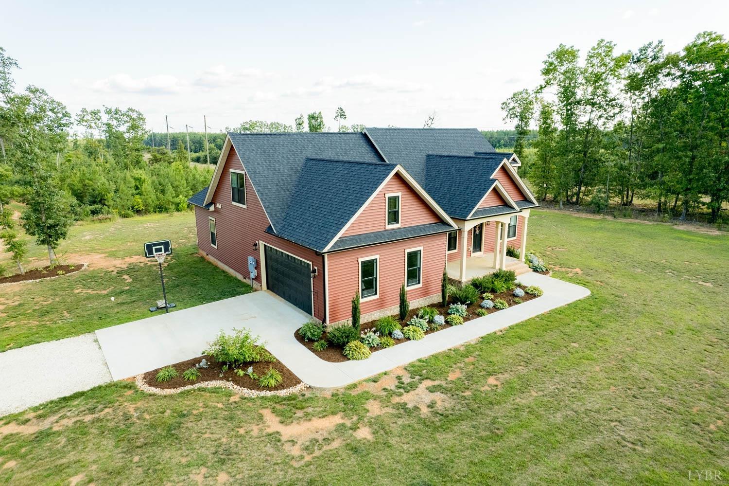 5972 Promise Land Road Appomattox, VA 24522 - Photo 63 of 84 a front view of house with yard and trees in the background