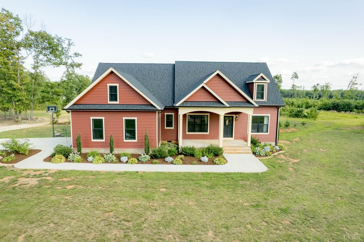 5972 Promise Land Road Appomattox, VA 24522 - Photo 64 of 84 a front view of a house with a yard and potted plants