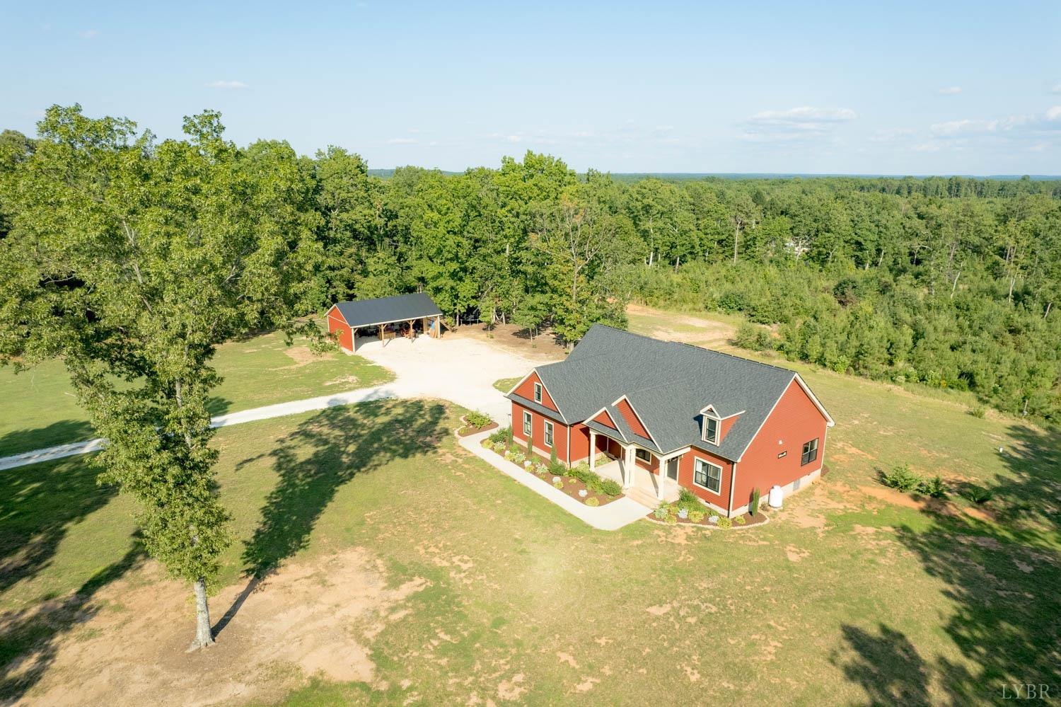 5972 Promise Land Road Appomattox, VA 24522 - Photo 76 of 84 an aerial view of a house with a yard and lake view