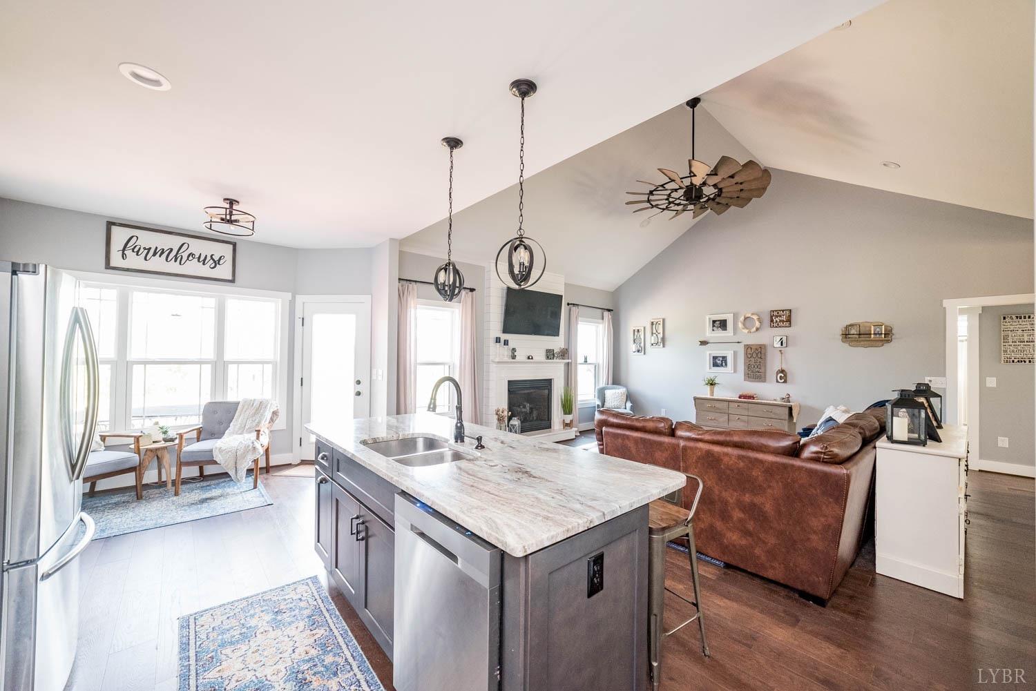 5972 Promise Land Road Appomattox, VA 24522 - Photo 10 of 84 a open kitchen with stainless steel appliances granite countertop a sink dishwasher a stove and a dining table with the kitchen view