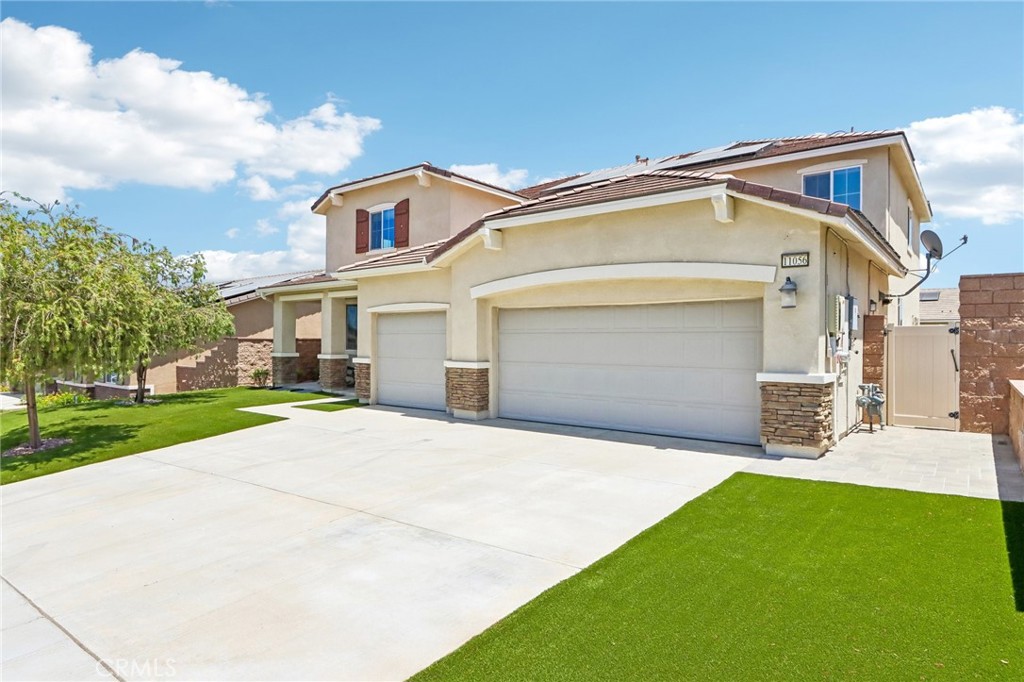 11056 Guffey Ranch Way Corona, CA 92883 - Photo 2 of 61 a front view of a house with garden