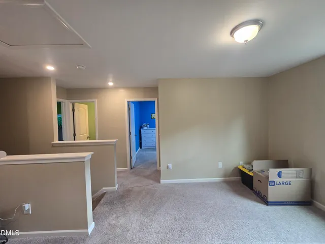 a view of an empty room and window