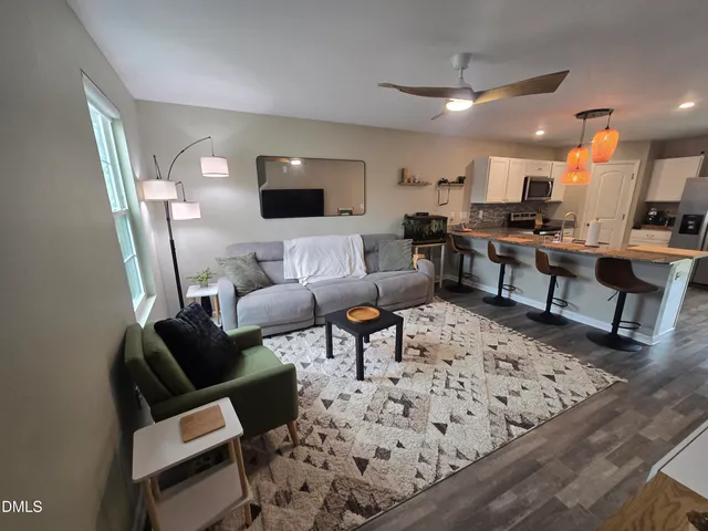 a living room with furniture and a couch