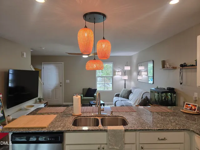 a living room with furniture and a flat screen tv