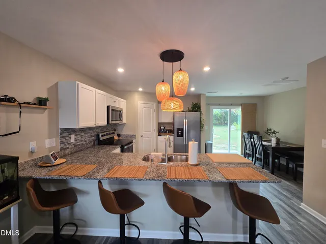 a view of a dining room with furniture
