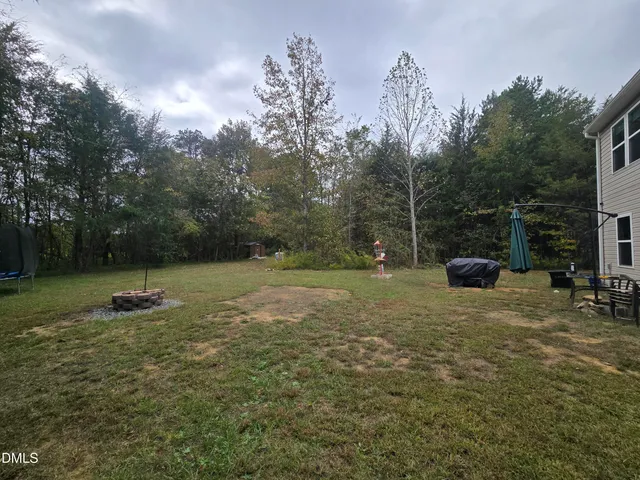 a backyard of a house with lots of green space