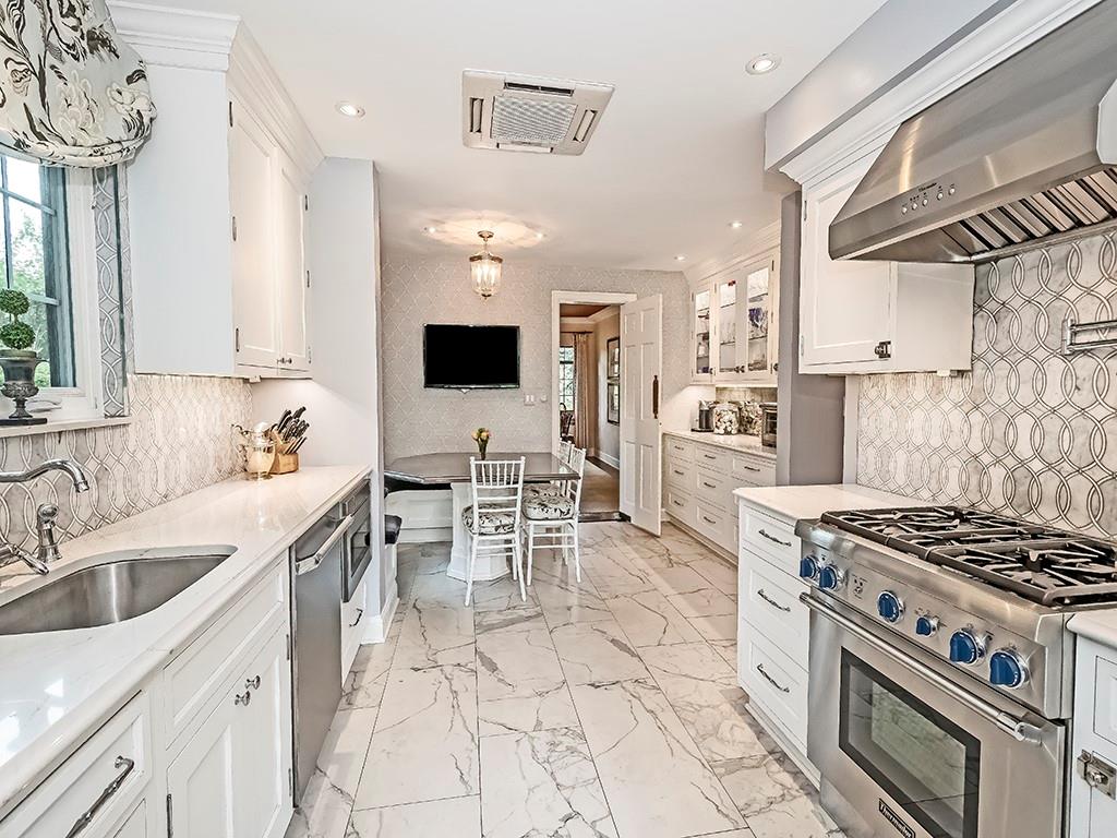 1174 Washington Road Pittsburgh, PA 15228 - Photo 11 of 47 a kitchen with stainless steel appliances a stove a sink and a refrigerator