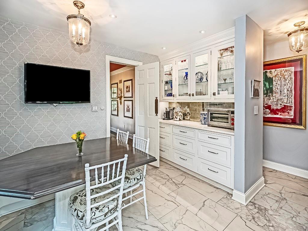 1174 Washington Road Pittsburgh, PA 15228 - Photo 12 of 47 a living room with stainless steel appliances kitchen island granite countertop furniture and a flat screen tv