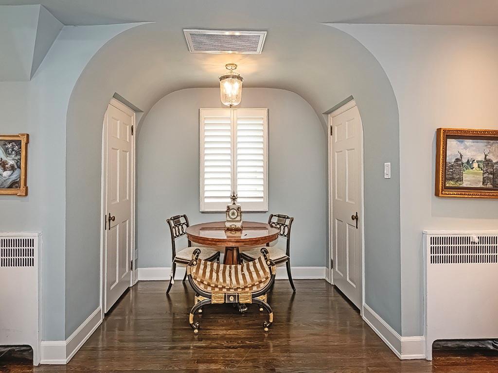 1174 Washington Road Pittsburgh, PA 15228 - Photo 19 of 47 a dining room with furniture a chandelier and wooden floor