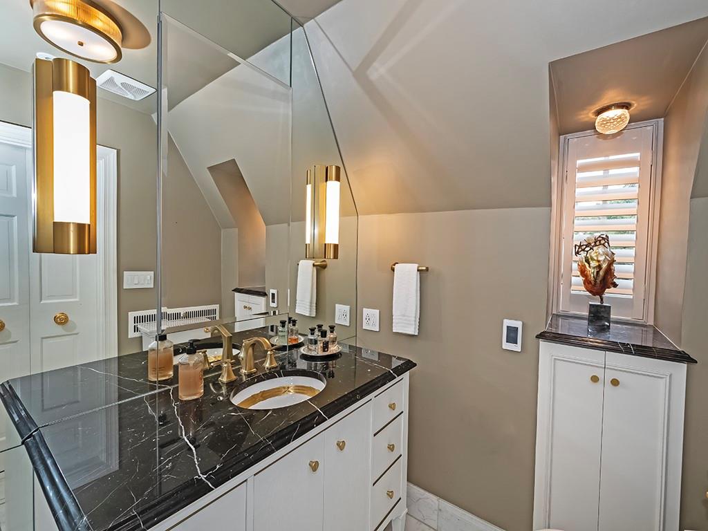 1174 Washington Road Pittsburgh, PA 15228 - Photo 20 of 47 a bathroom with a granite countertop sink and a mirror
