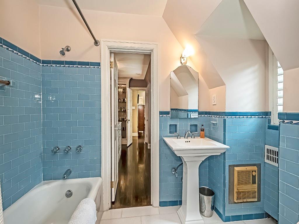 1174 Washington Road Pittsburgh, PA 15228 - Photo 23 of 47 a bathroom with a sink a mirror and a bathtub