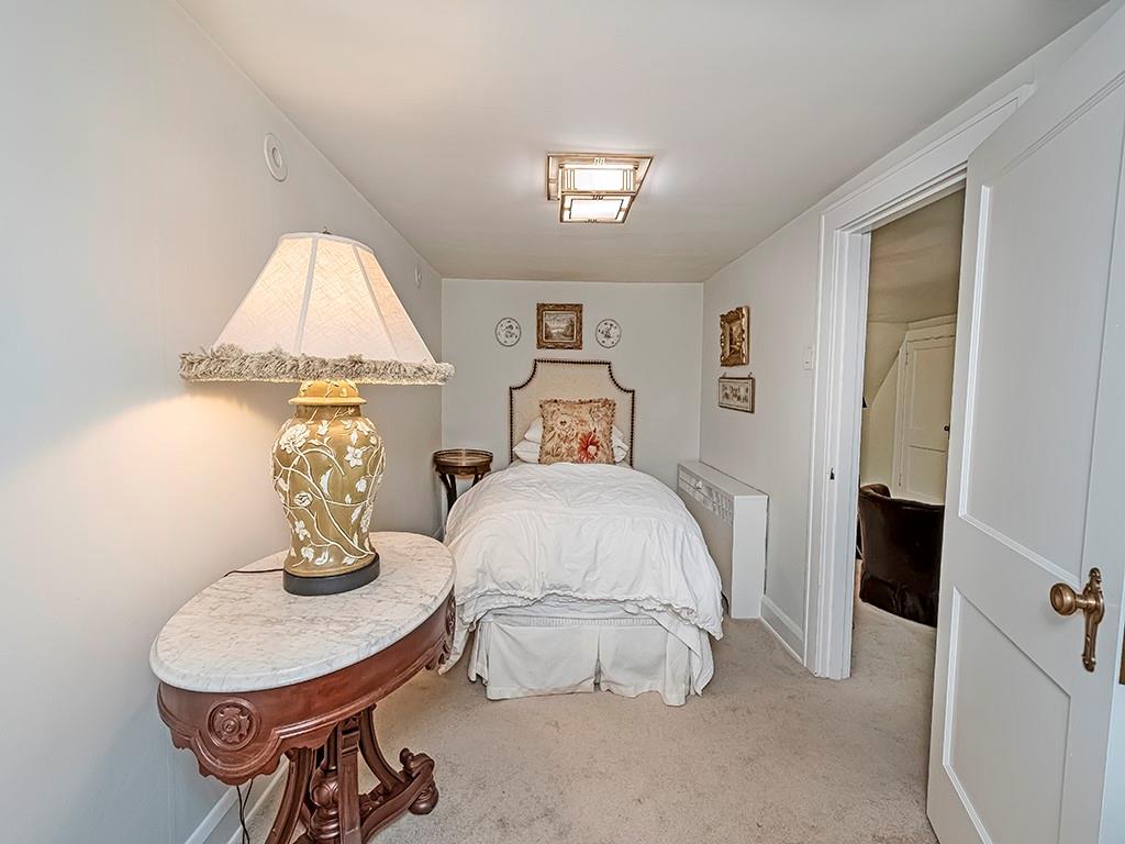 1174 Washington Road Pittsburgh, PA 15228 - Photo 31 of 47 a bedroom with a bed and a table