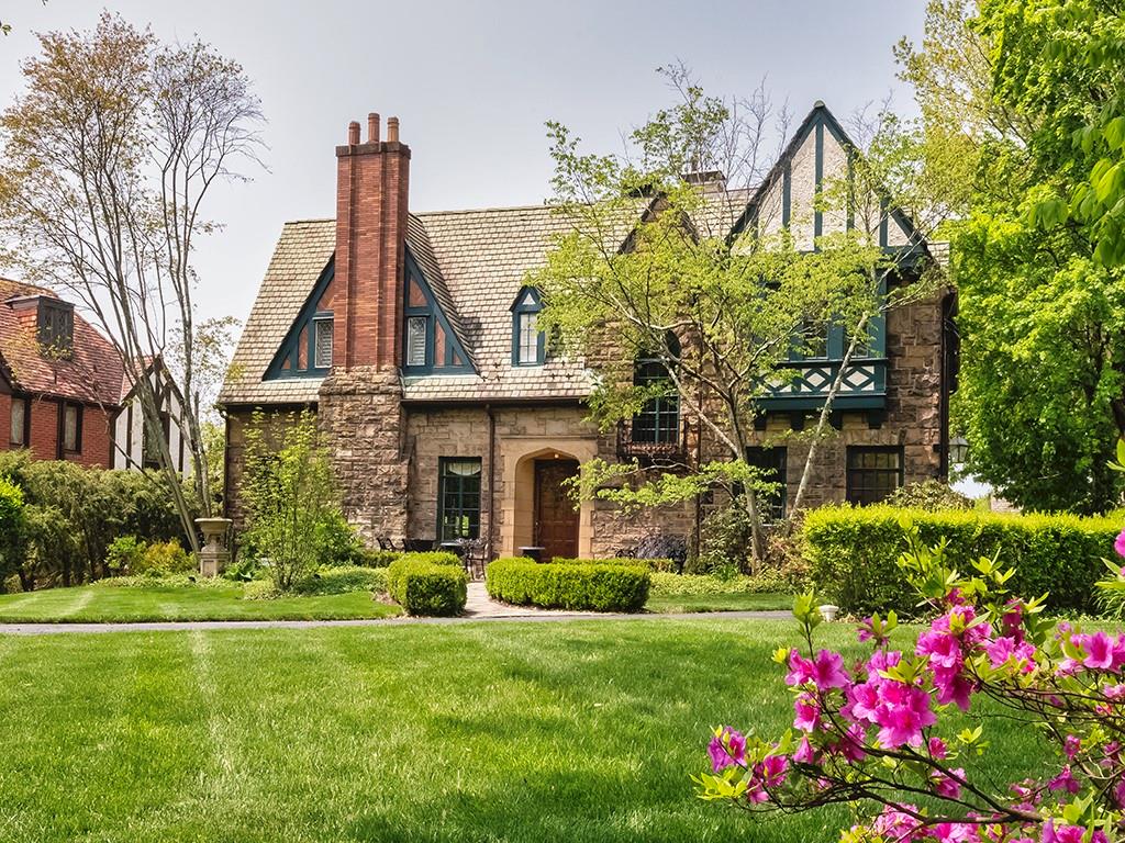 1174 Washington Road Pittsburgh, PA 15228 - Photo 42 of 47 a front view of a house with a garden and plants