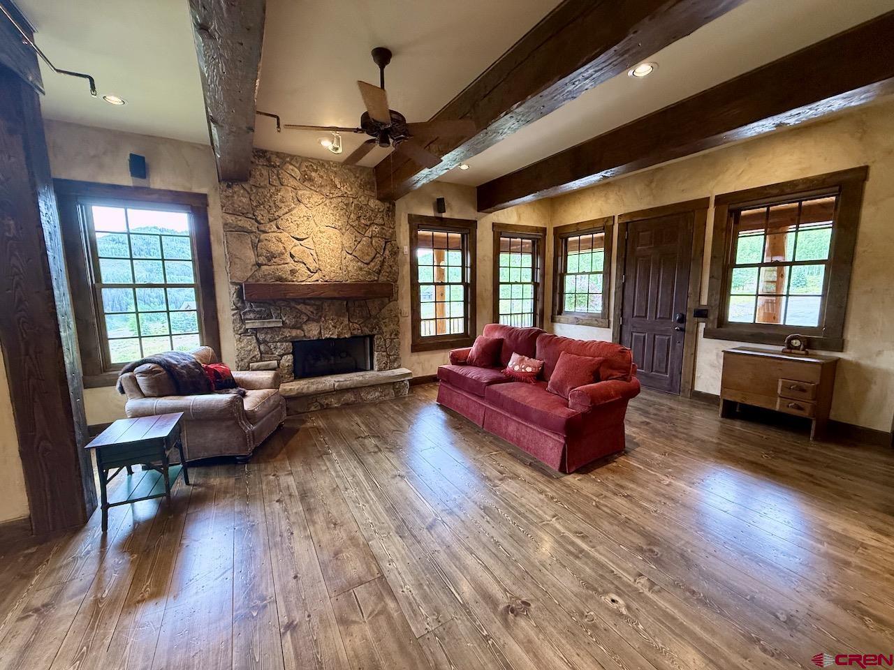 88 Castle Rock Court Crested Butte, CO 81224 - Photo 12 of 44 a living room with furniture fireplace and flat screen tv