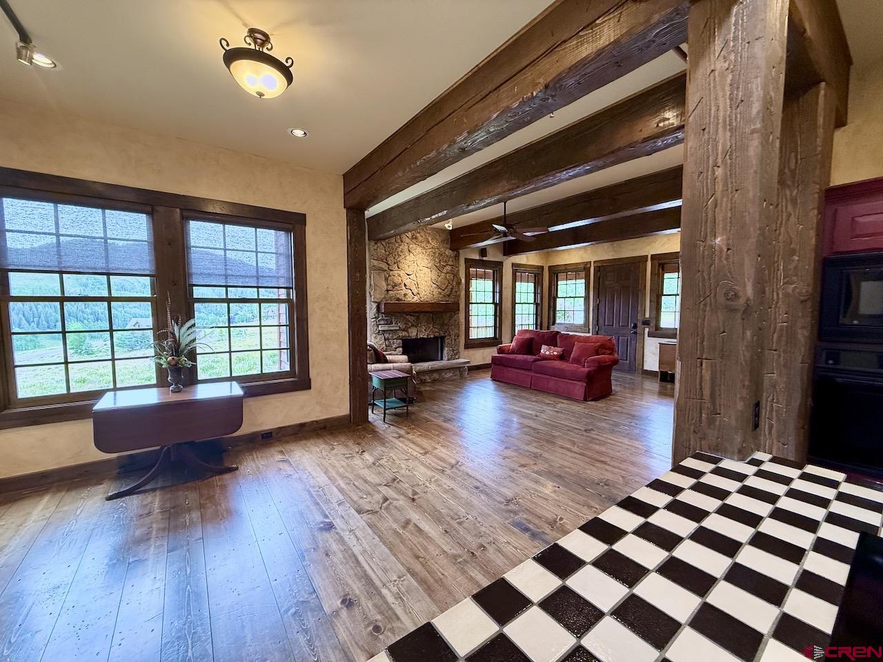 88 Castle Rock Court Crested Butte, CO 81224 - Photo 13 of 44 a living room with furniture and a large window