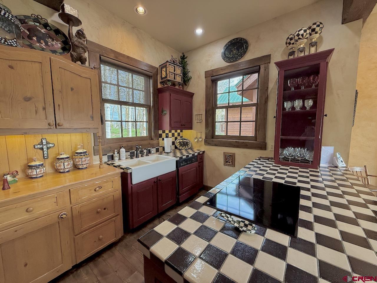 88 Castle Rock Court Crested Butte, CO 81224 - Photo 19 of 44 a kitchen with a stove a sink and a window