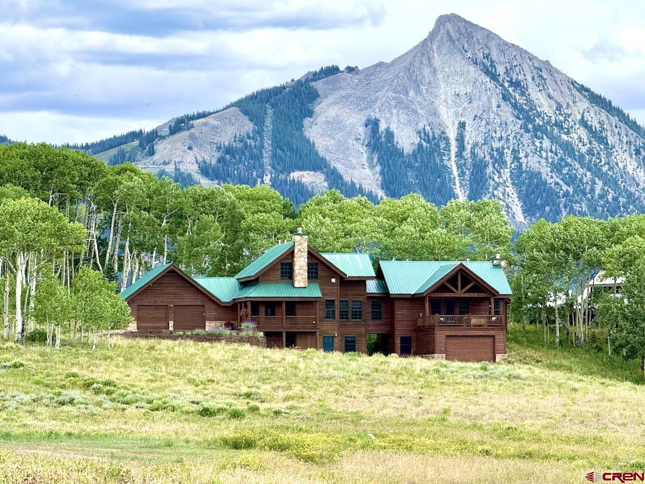 88 Castle Rock Court Crested Butte, CO 81224 - Photo 2 of 44 a house with trees in the background
