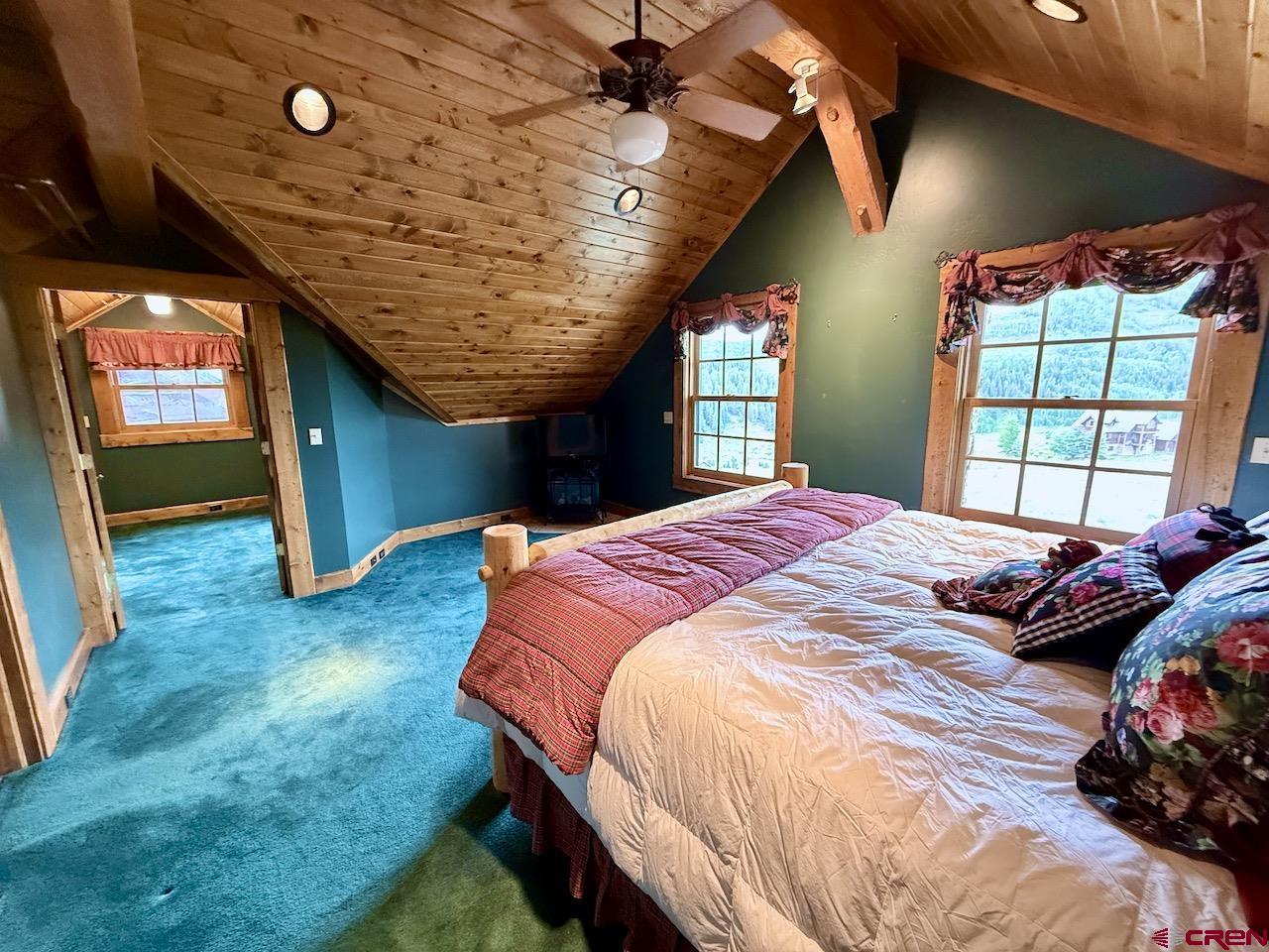88 Castle Rock Court Crested Butte, CO 81224 - Photo 21 of 44 a bedroom with a bed and a window