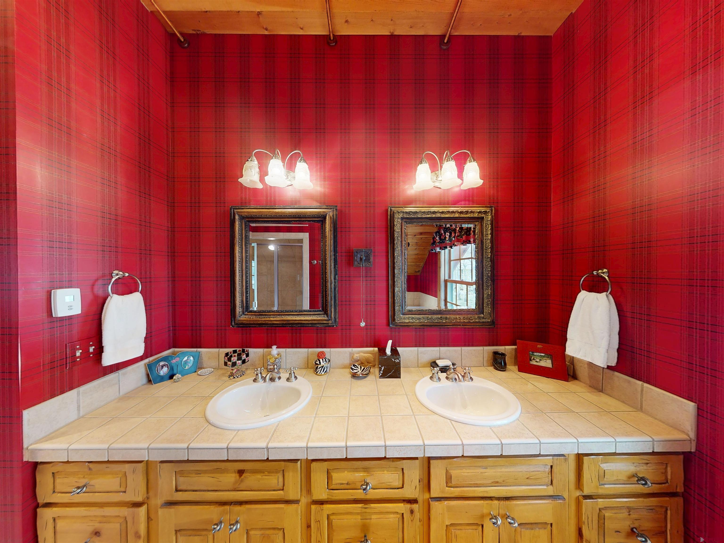 88 Castle Rock Court Crested Butte, CO 81224 - Photo 26 of 44 a bathroom with a sink and a mirror
