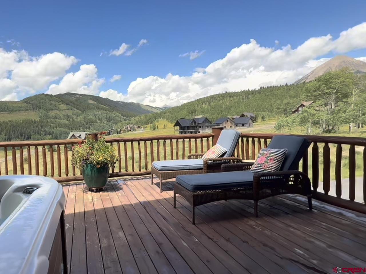 88 Castle Rock Court Crested Butte, CO 81224 - Photo 30 of 44 a view of a balcony with wooden floor and outdoor seating