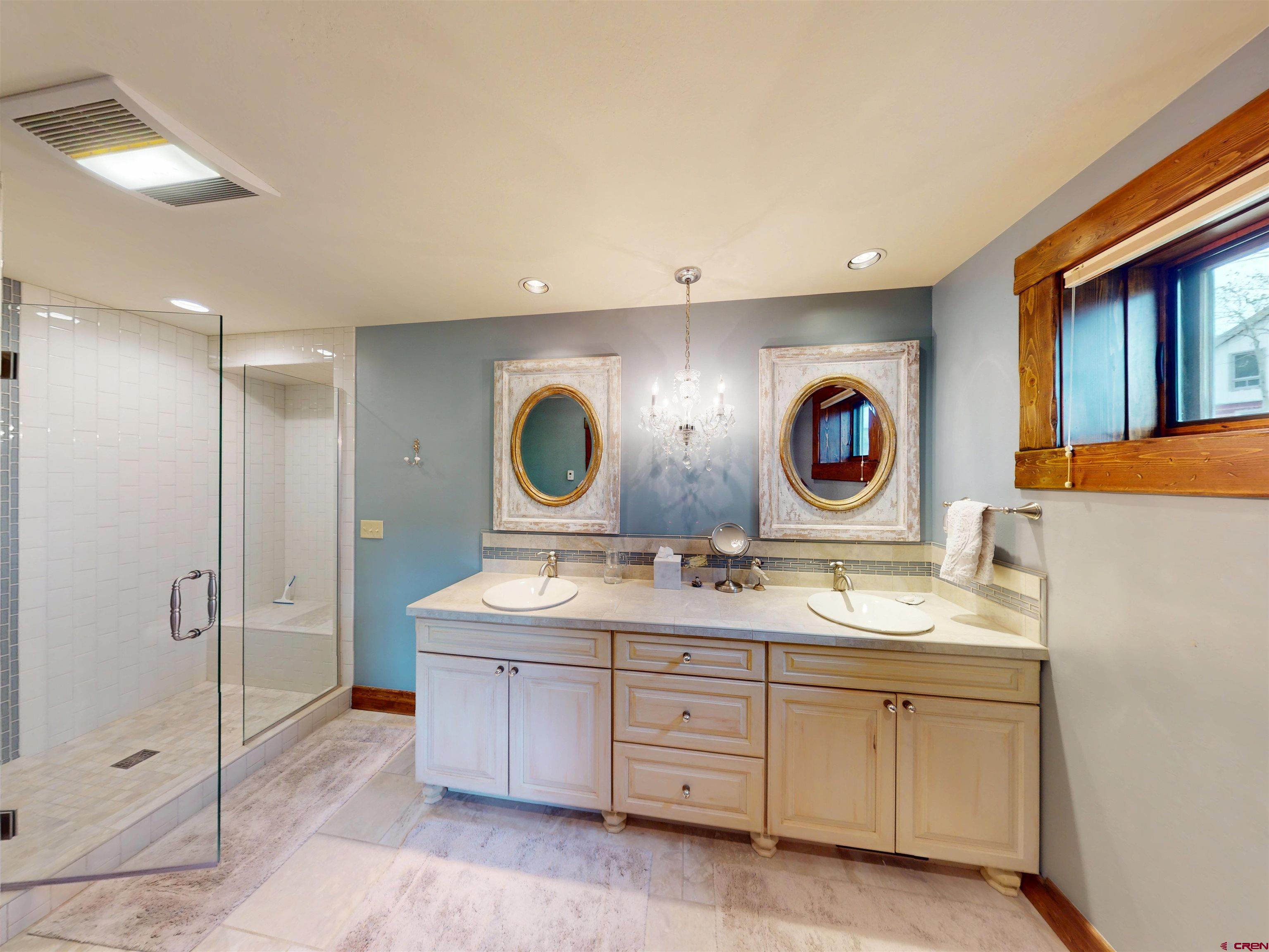 88 Castle Rock Court Crested Butte, CO 81224 - Photo 34 of 44 a room with two mirror and a sink