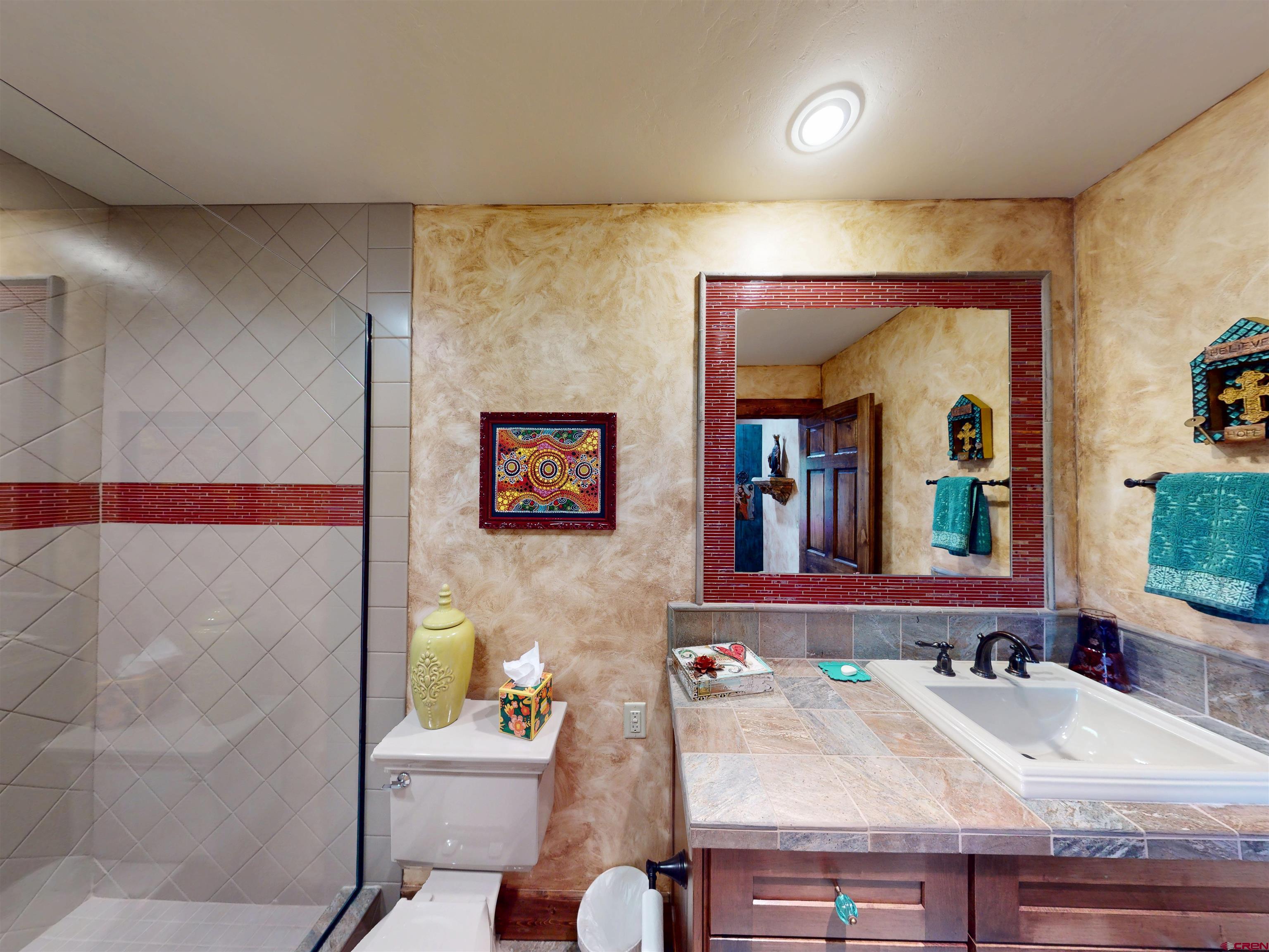 88 Castle Rock Court Crested Butte, CO 81224 - Photo 38 of 44 a bathroom with a sink and a mirror