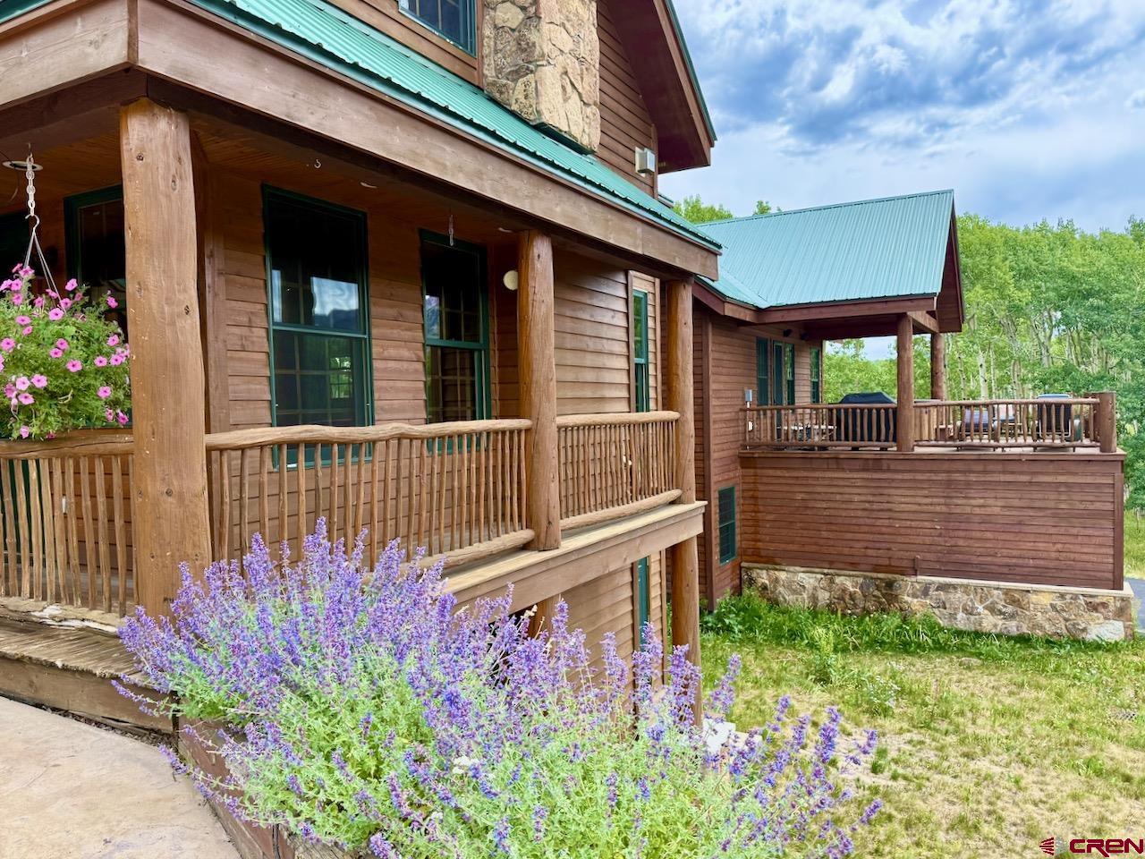 88 Castle Rock Court Crested Butte, CO 81224 - Photo 4 of 44 front view of a house with a yard