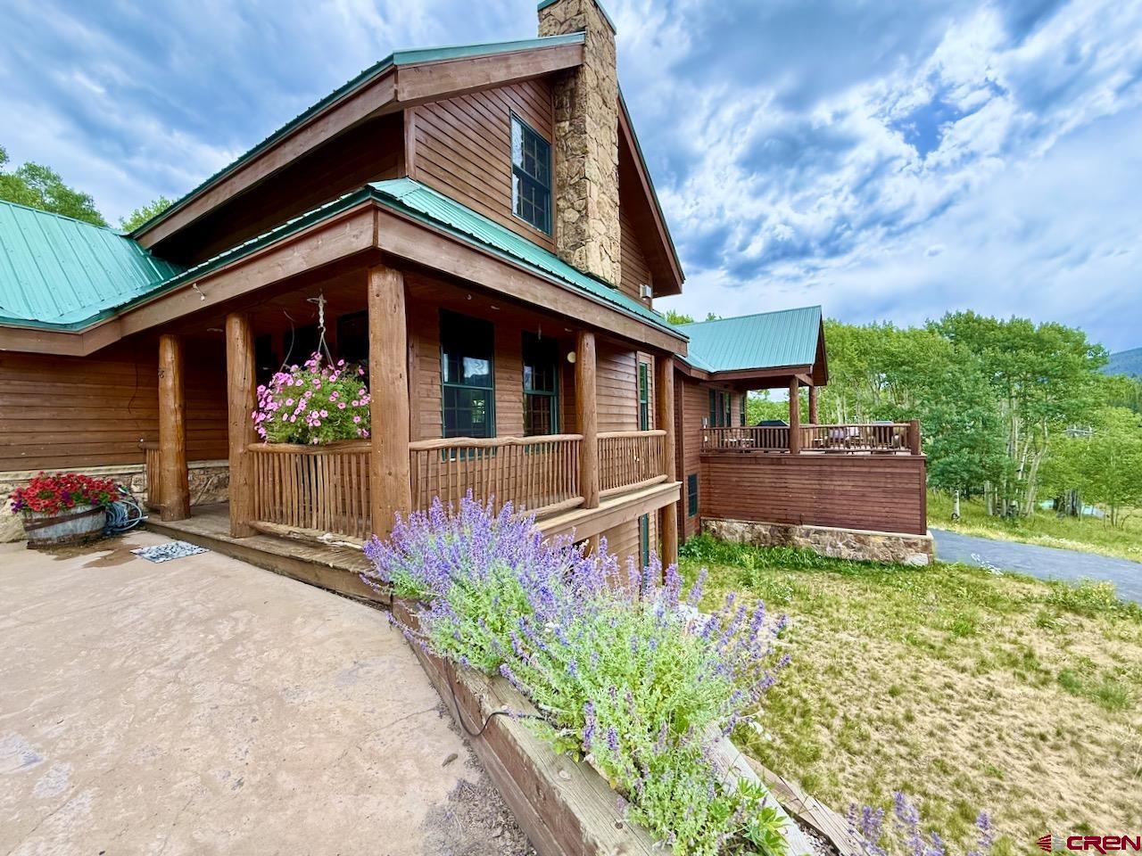 88 Castle Rock Court Crested Butte, CO 81224 - Photo 43 of 44 front view of a house with a small yard