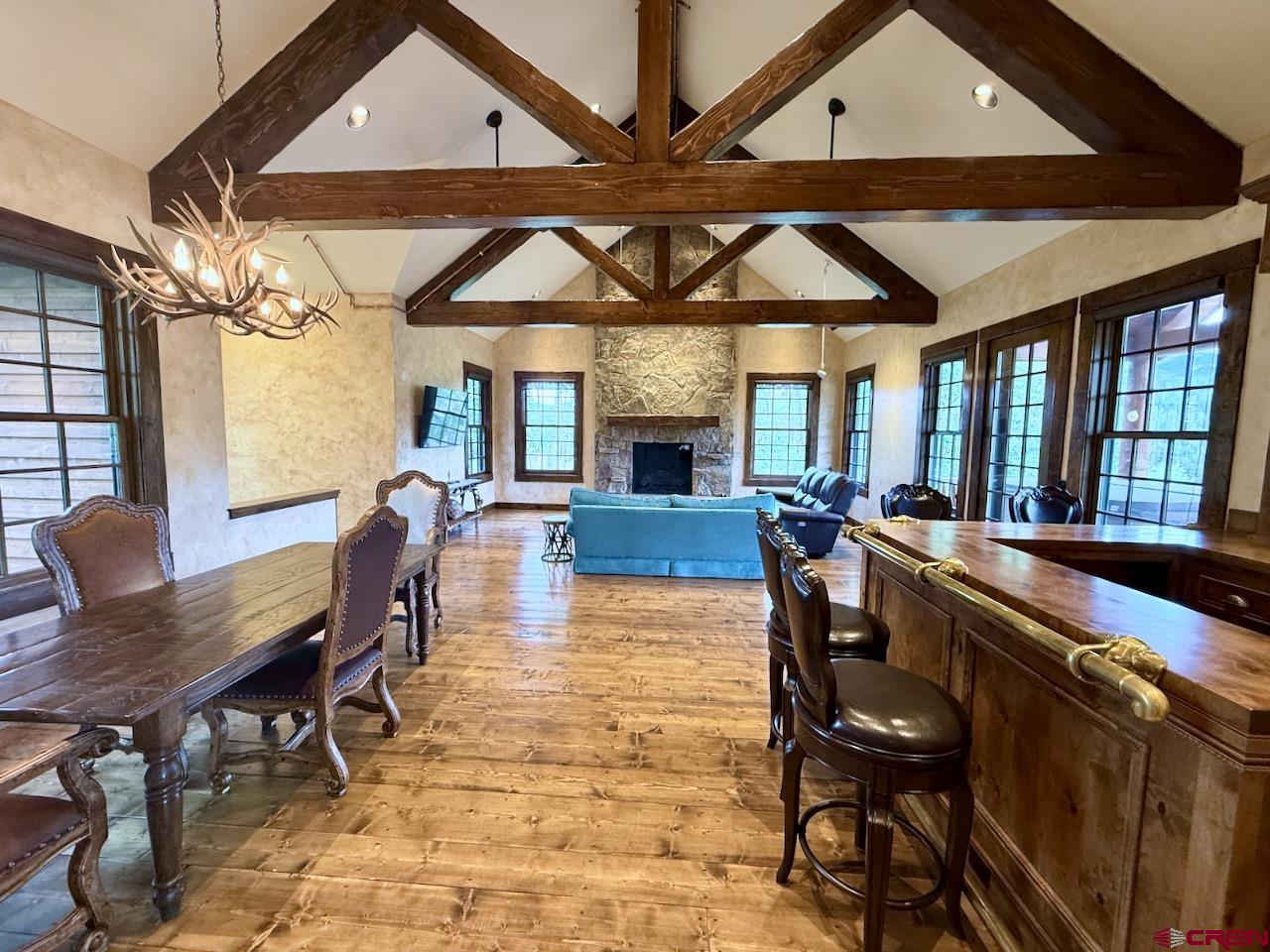 88 Castle Rock Court Crested Butte, CO 81224 - Photo 5 of 44 a view of a dining room with furniture window and wooden floor