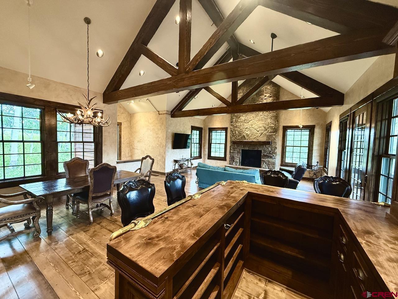 88 Castle Rock Court Crested Butte, CO 81224 - Photo 9 of 44 a living room with furniture a fireplace and a table