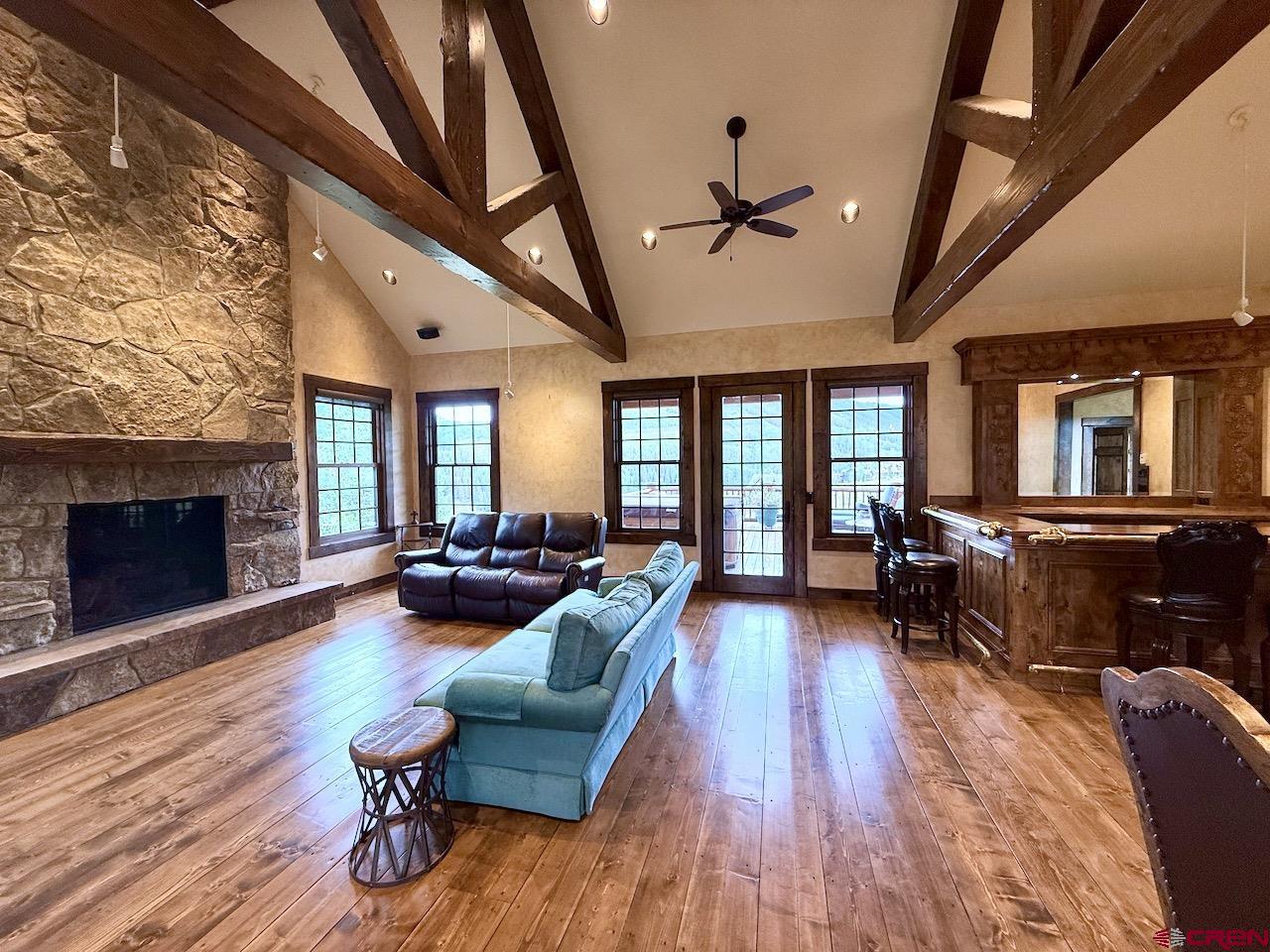 88 Castle Rock Court Crested Butte, CO 81224 - Photo 9 of 44 a living room with furniture and a fireplace
