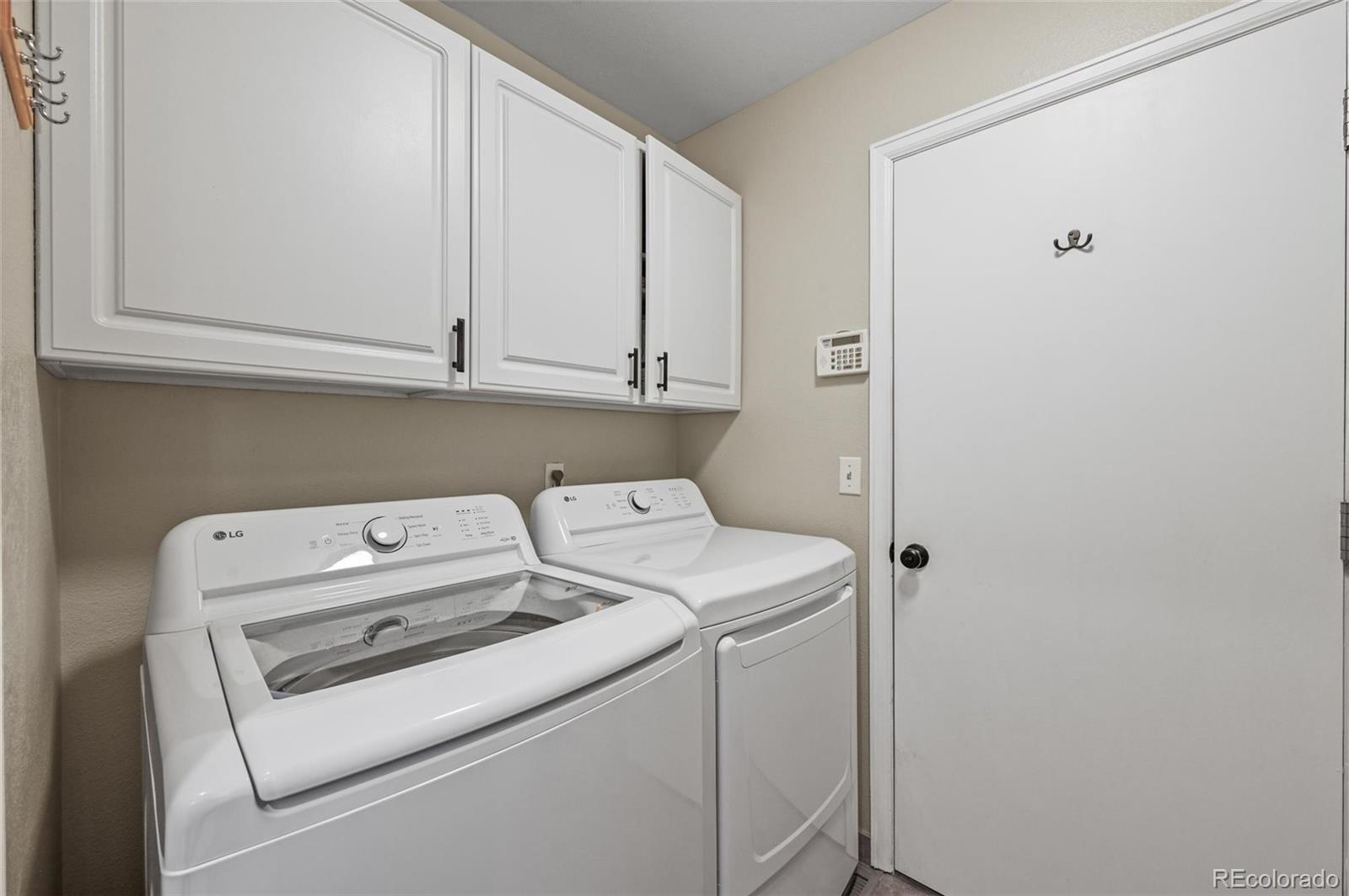 10096 Hughes Place Highlands Ranch, CO 80126 - Photo 16 of 50 a utility room with dryer and washer