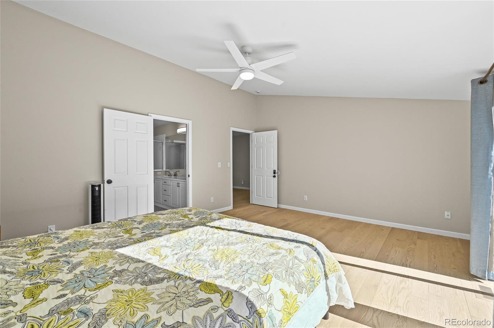 10096 Hughes Place Highlands Ranch, CO 80126 - Photo 21 of 50 a bedroom with a bed and a window