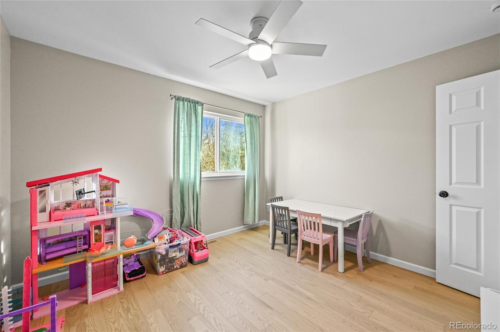 10096 Hughes Place Highlands Ranch, CO 80126 - Photo 26 of 50 a bedroom with furniture and a window