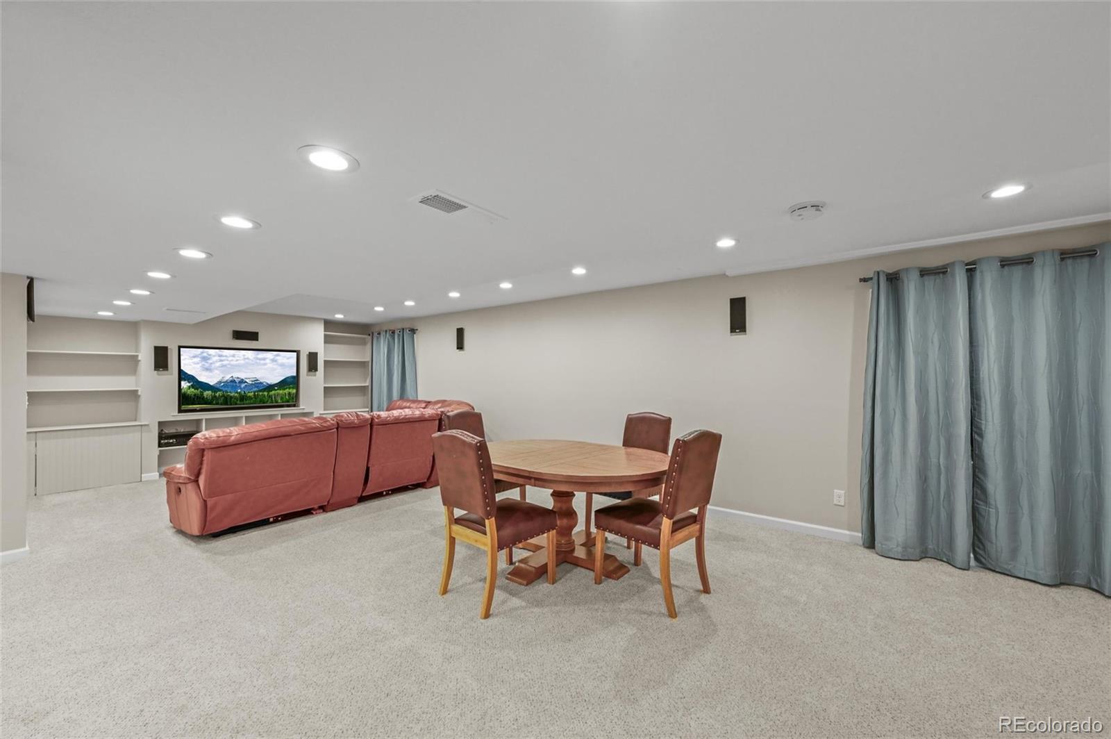 10096 Hughes Place Highlands Ranch, CO 80126 - Photo 33 of 50 a view of a dining room with furniture