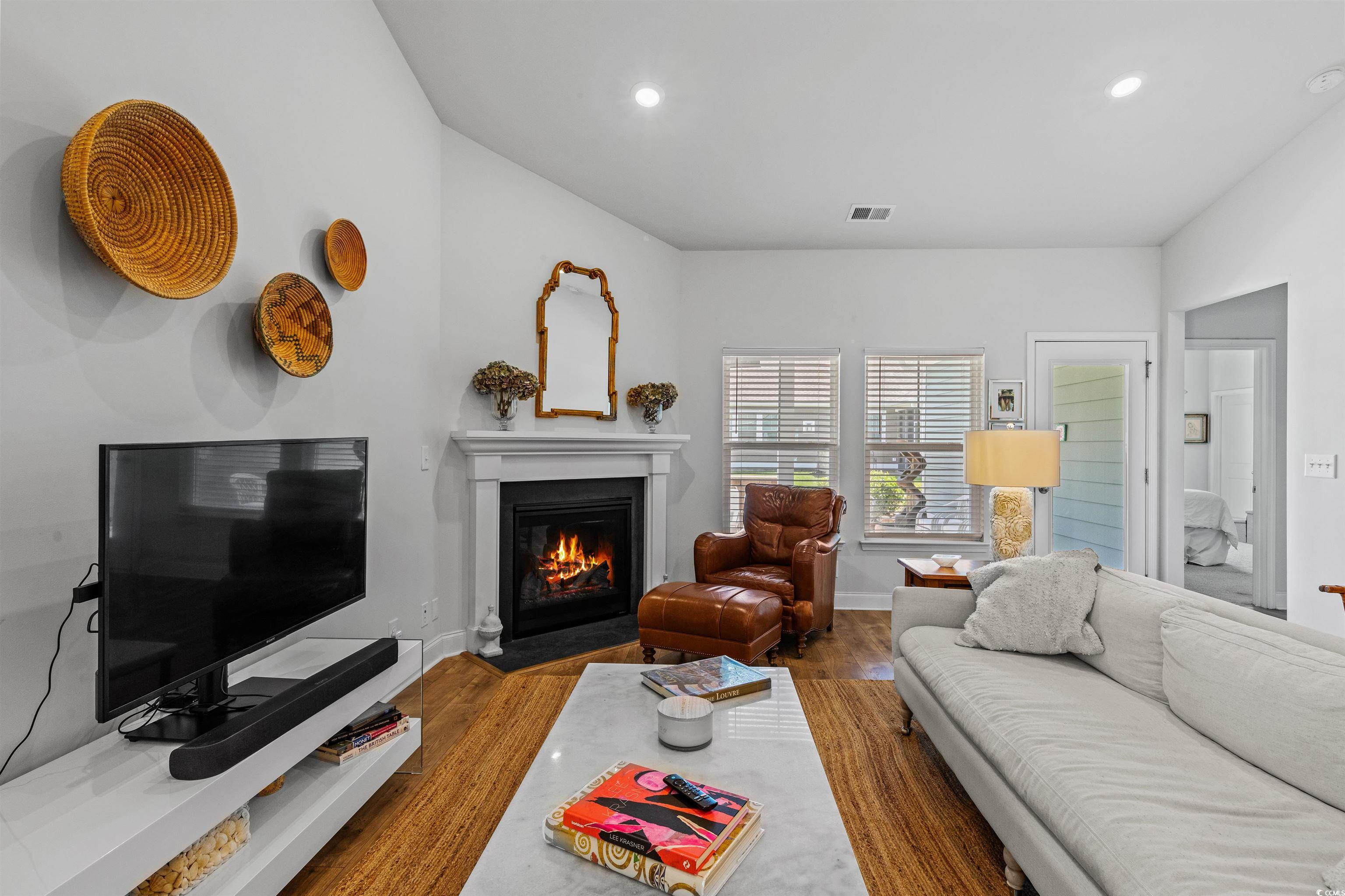 2464 Rock Dove Road Myrtle Beach, SC 29577 - Photo 13 of 34 Living room with recessed lighting, baseboards, a fireplace with flush hearth, and wood finished floors