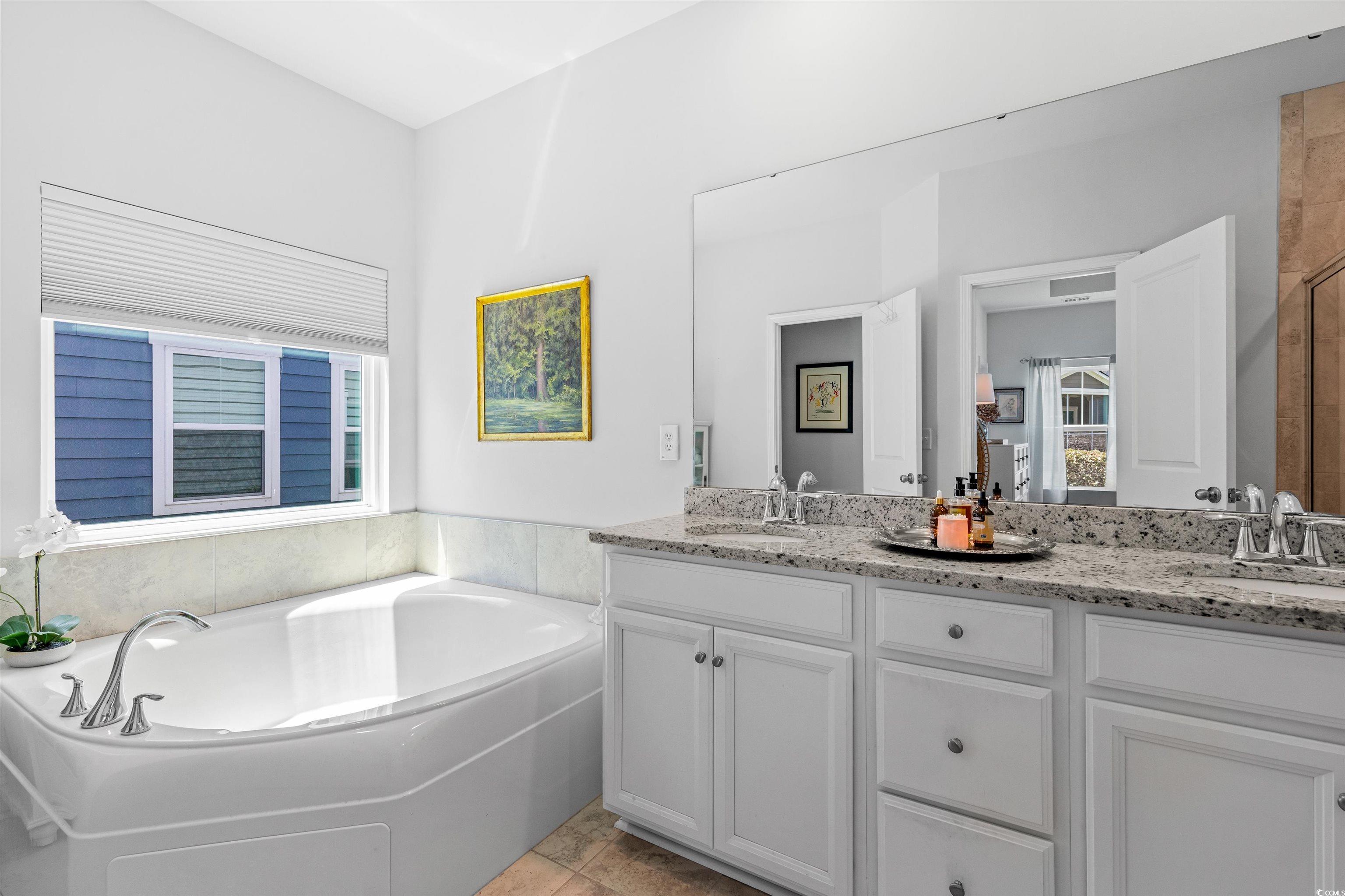 2464 Rock Dove Road Myrtle Beach, SC 29577 - Photo 20 of 34 Full bathroom with double vanity, a bath, and an enclosed shower